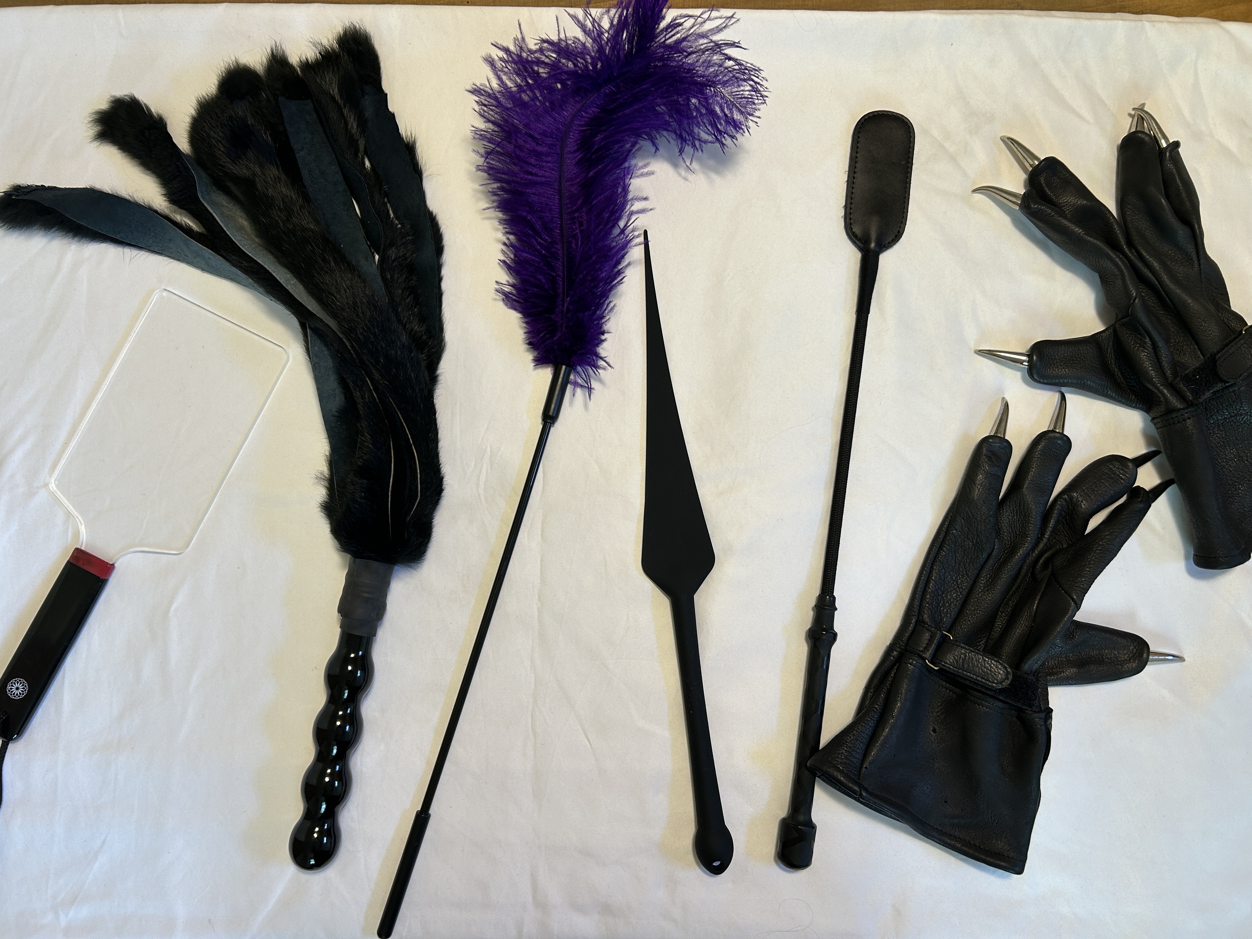 various tools for thuddy and stingy play. All rest on a white sheet